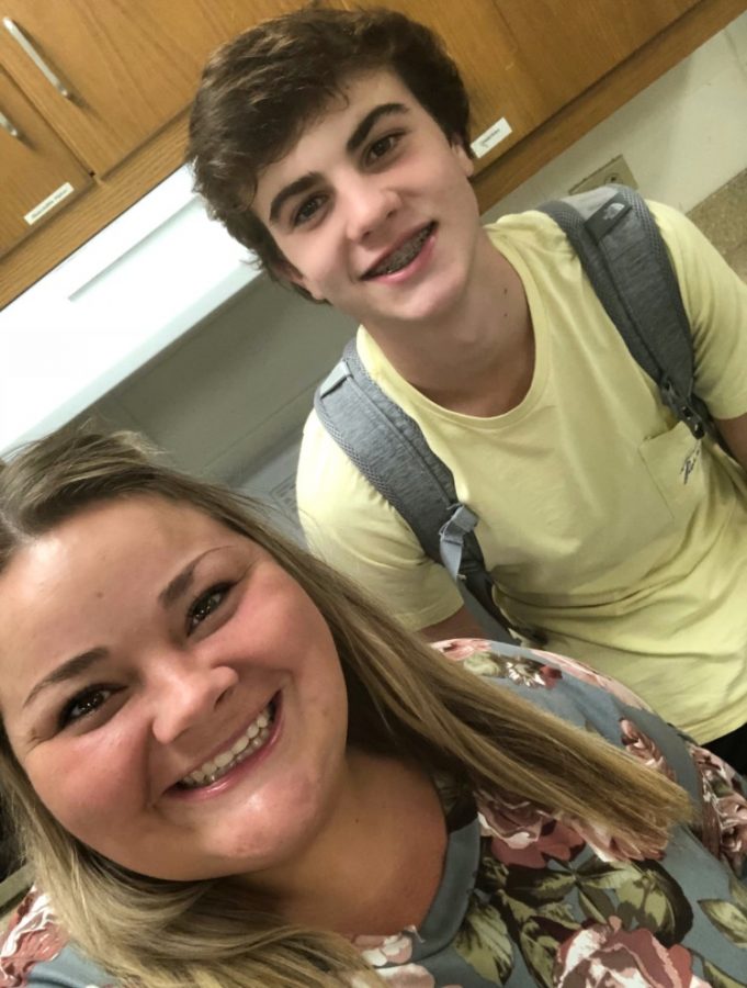 Ms. Spicer takes a break from interpreting to hang out with Cade Stinnett, one of the basketball players she coached last year at Drakes. 